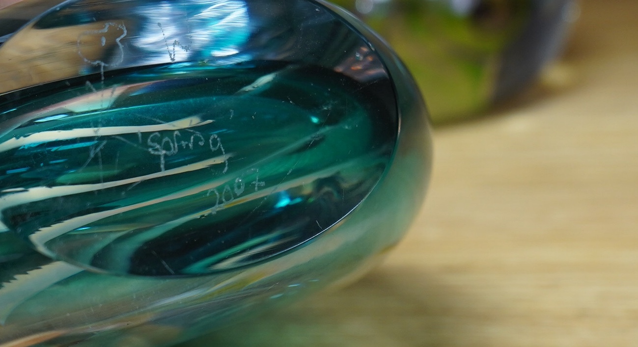 Two Siddy Langley glass paperweights and a contemporary glass vase, 12.5cm tall. Condition - good